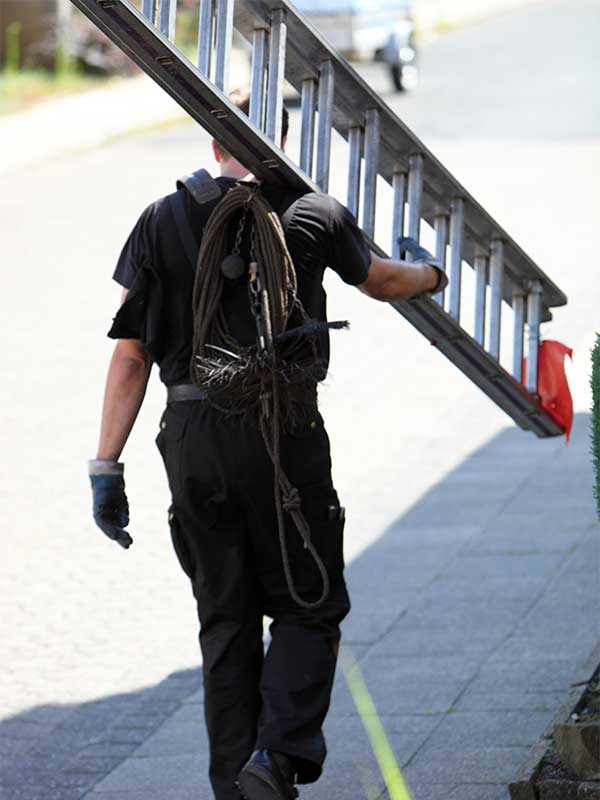 Chimney Sweeping - Technician with Ladder Chimney Sweeping - Technician with Ladder